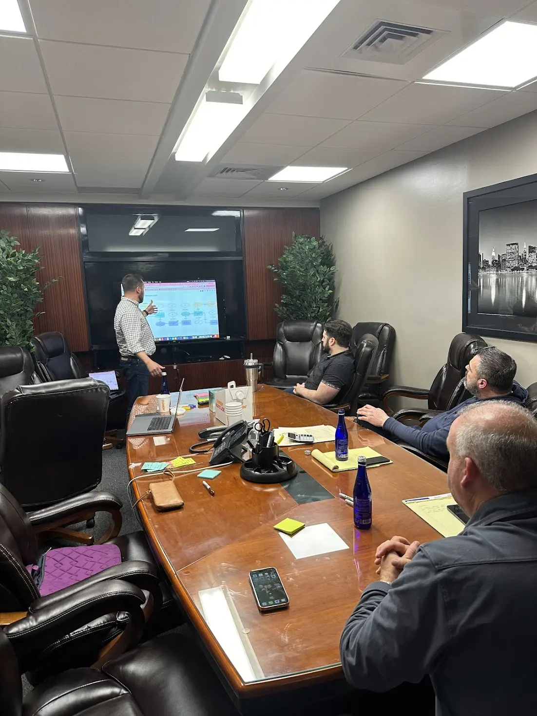 People sitting around a conference table discussing work