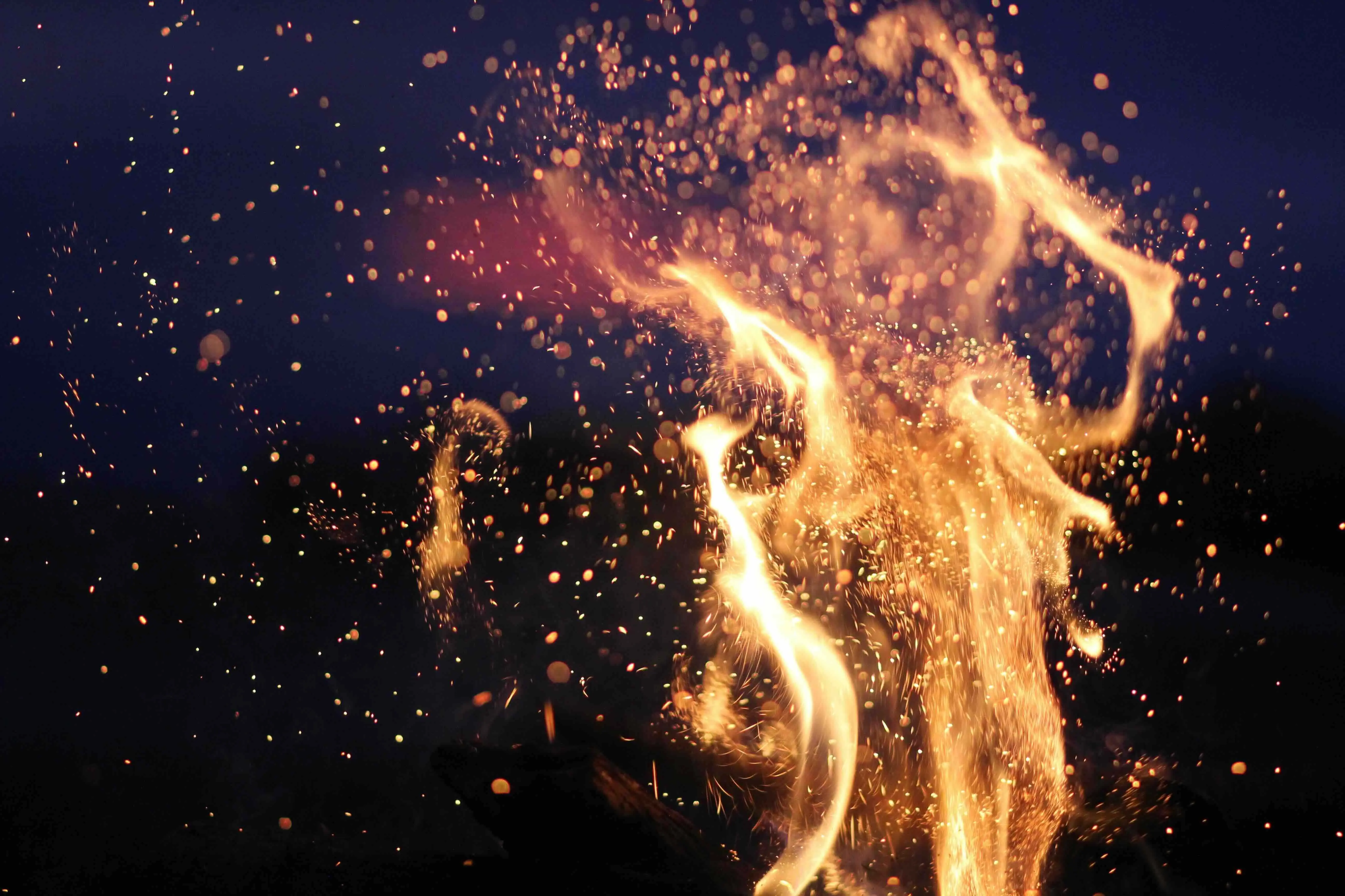 Flames and sparks against a dark background