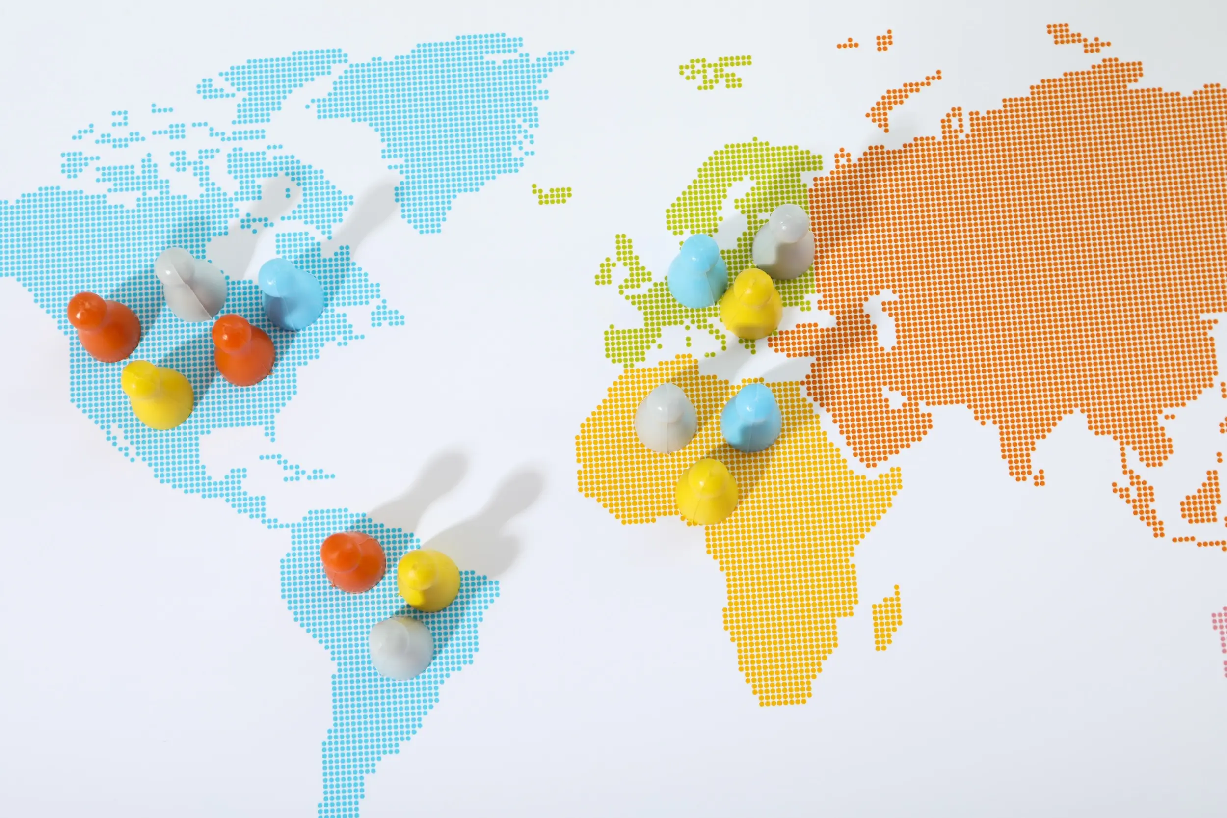 A colorful world map with different markers of people across different countries.