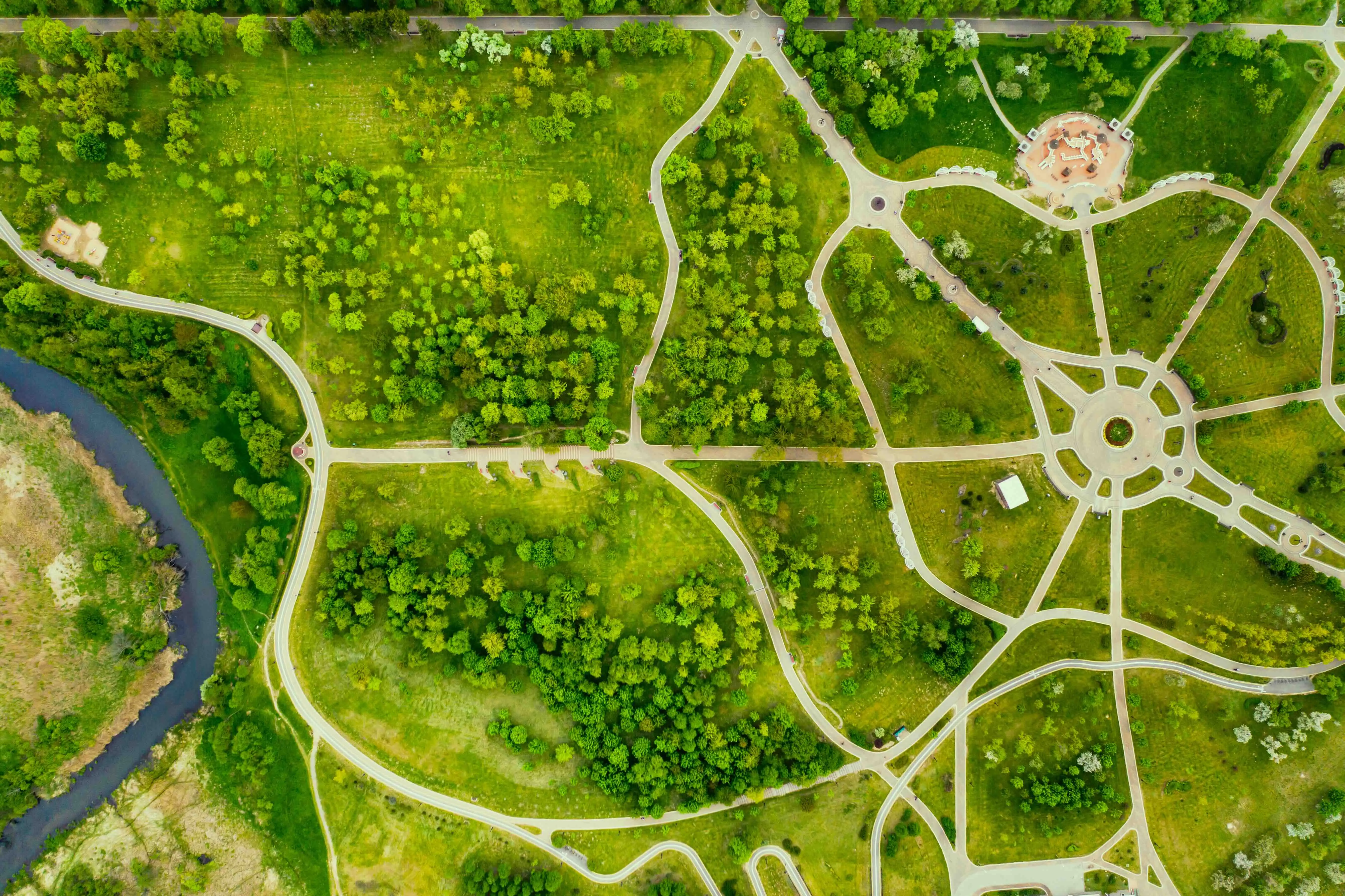 An overhead view of a park with many walking paths converging