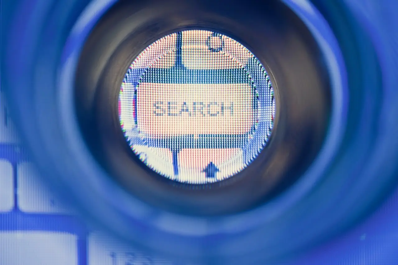 A magnified keyboard button with the word "search" on it.