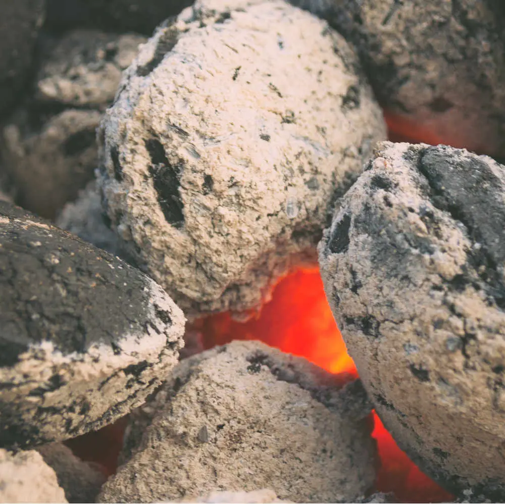 Burning ember under stones
