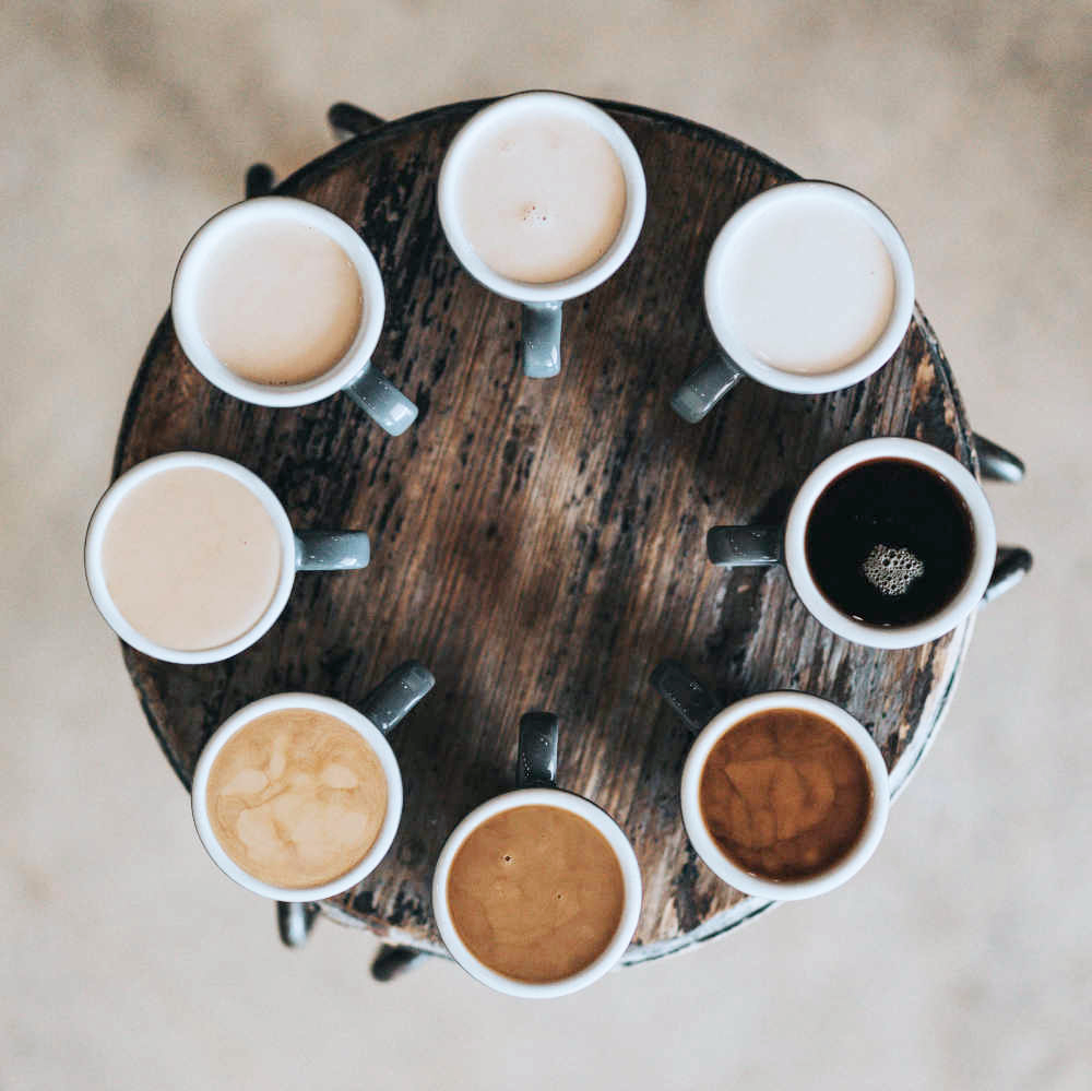 Cups of coffee set around a table