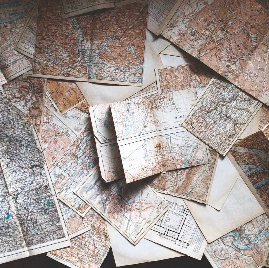 A stack of maps on a table