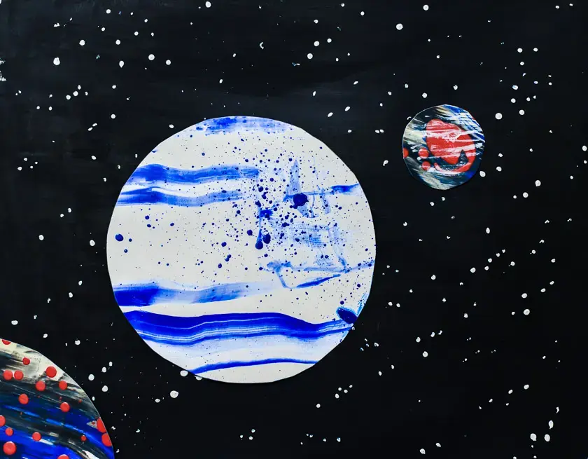 Painted planets on a background of stars